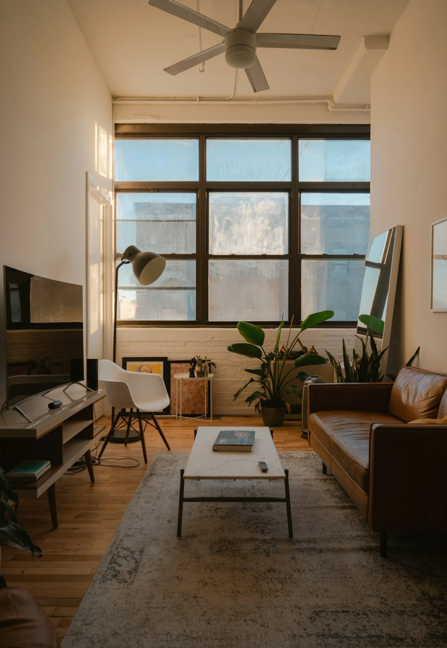 a living room with a green couch and a coffee table